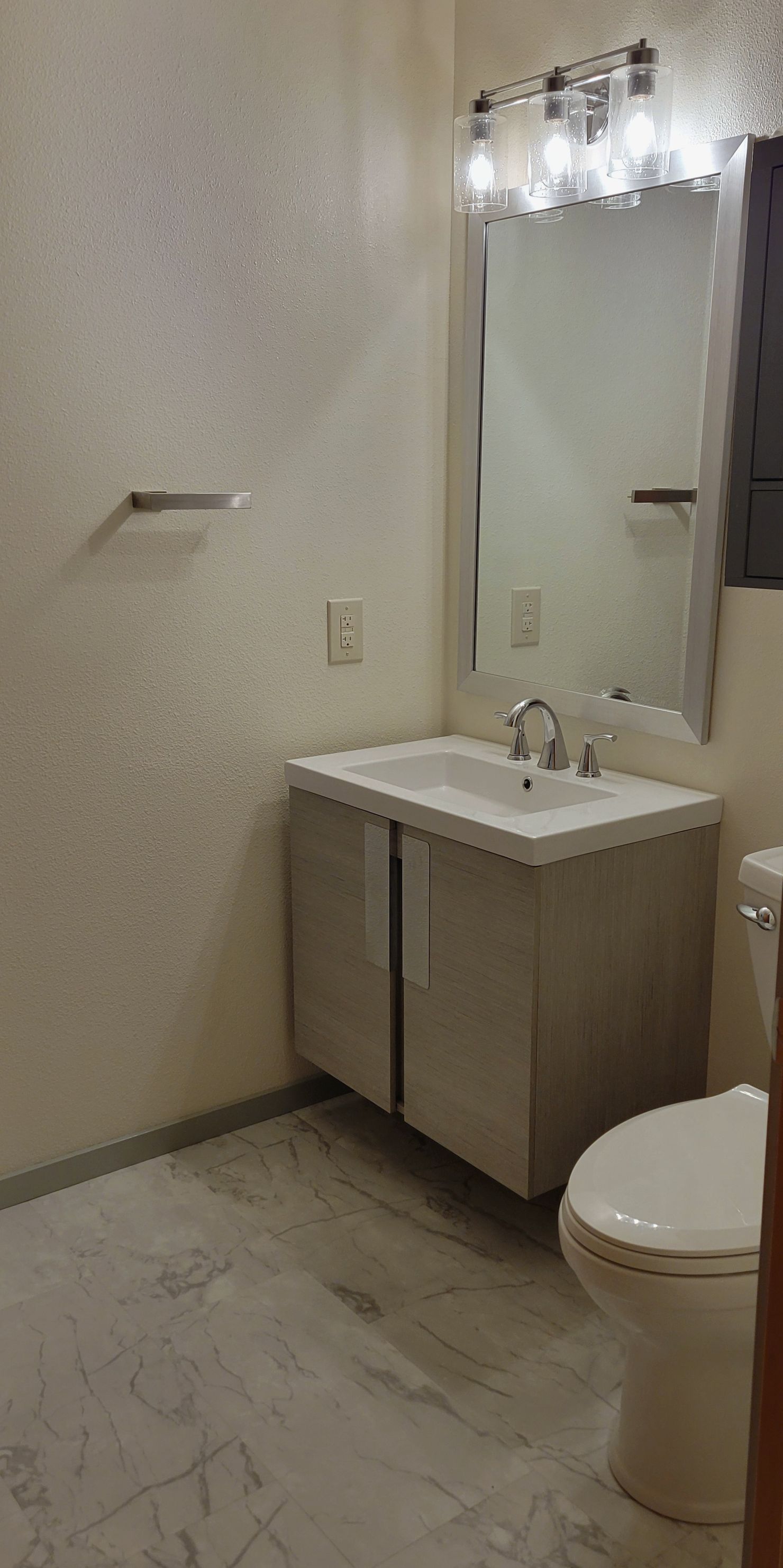 There is a bathroom now, but it was just a blank slab of basement concrete.