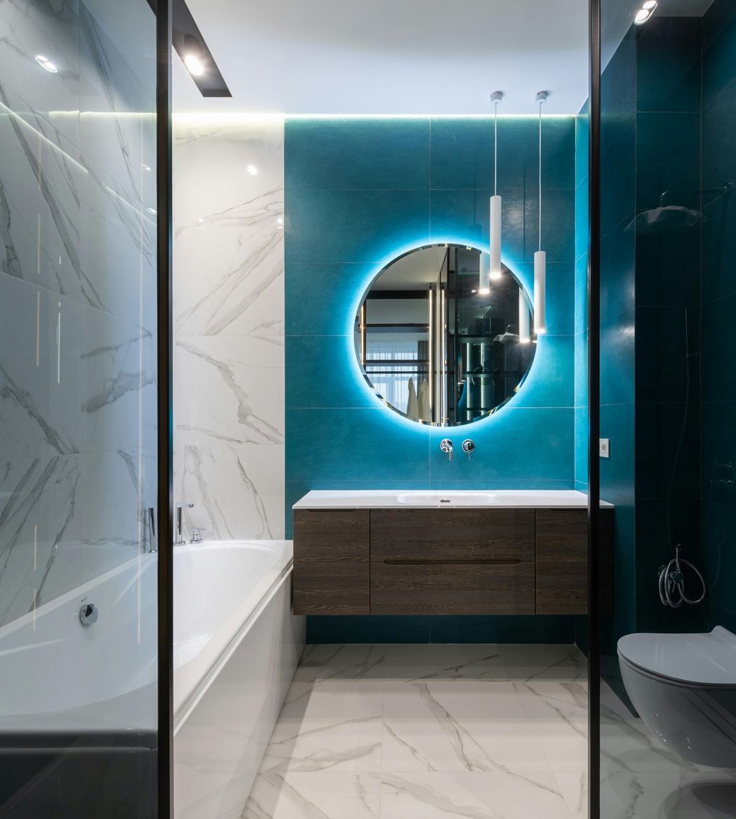 modern bathroom with backlit mirror