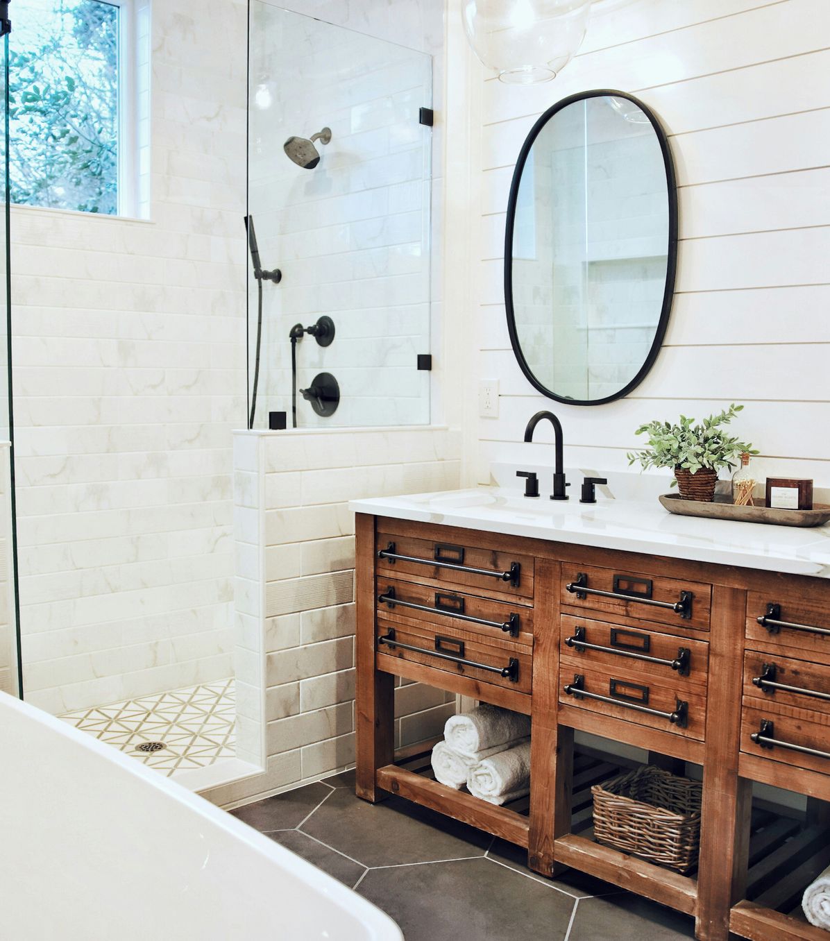 bathroom with custom tile and glass shower