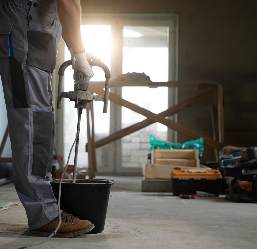 tiling worker operating machinery